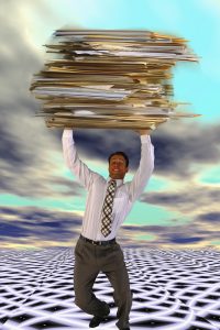 Businessman Carrying Giant Files