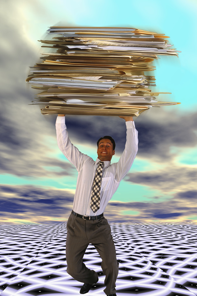 Businessman Carrying Giant Files