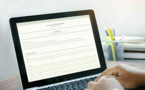 Job seeker filling out an employment application using caregiver management software.