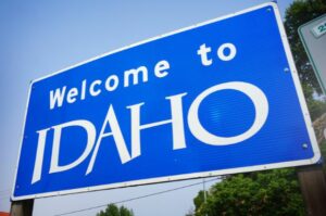 a blue sign that says welcome to Idaho