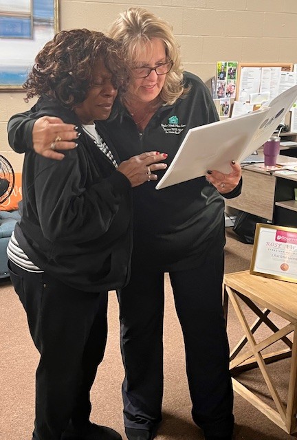 Charlene Gamble, reading testimonials sent by clients submitted for her ROSE Award nomination