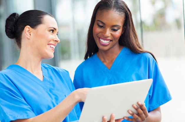 home care agency staff looking at a smart home care software